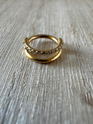 Gold septum piercing earring with sparkling stones