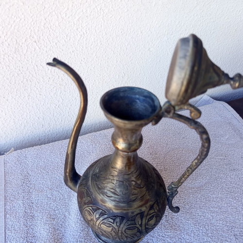 Brass jug with engraved decoration, Asian origin
