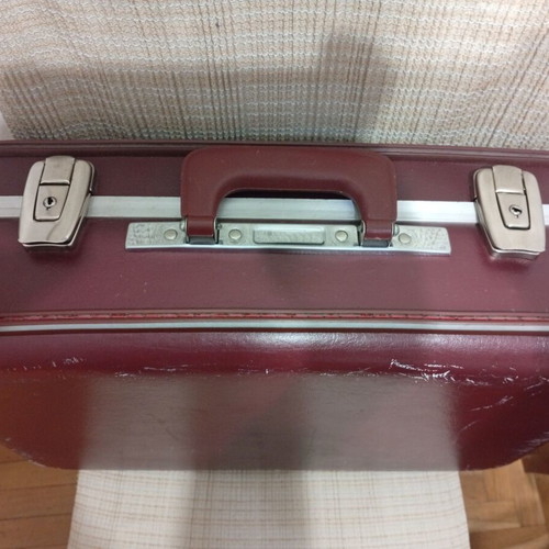 Vintage travel suitcase used, burgundy leather exterior