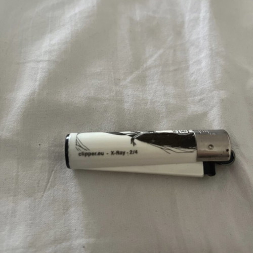 Clipper X Ray 2/4 lighter used, empty for collectible use