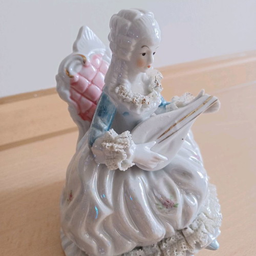 Porcelain vintage decorative girl with mandolin used