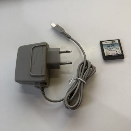 Nintendo DSi used with 1 game and 1 charger