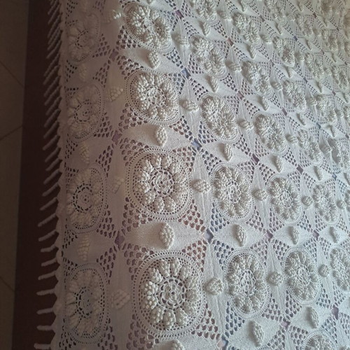 Handmade super double blanket with embossed designs and crocheted fringes