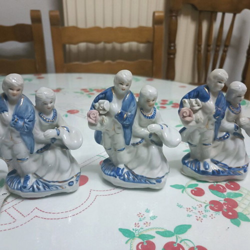 Porcelain figurines like new, pair with pink, blue, and gold flowers