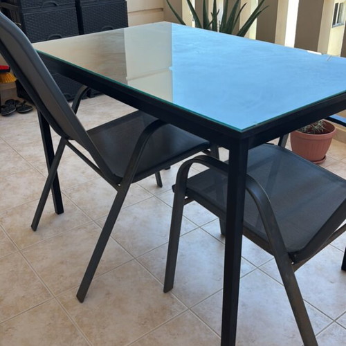 Garden table with glass top and 2 chairs used