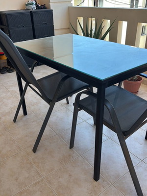 Garden table with glass top and 2 chairs used