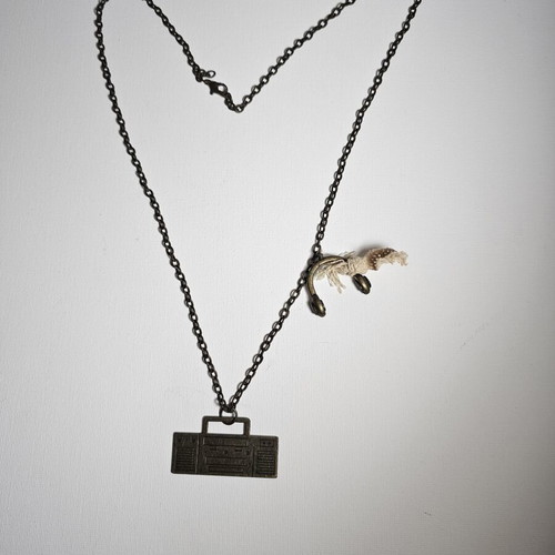 Vintage necklace with cassette player pendant and headphones used