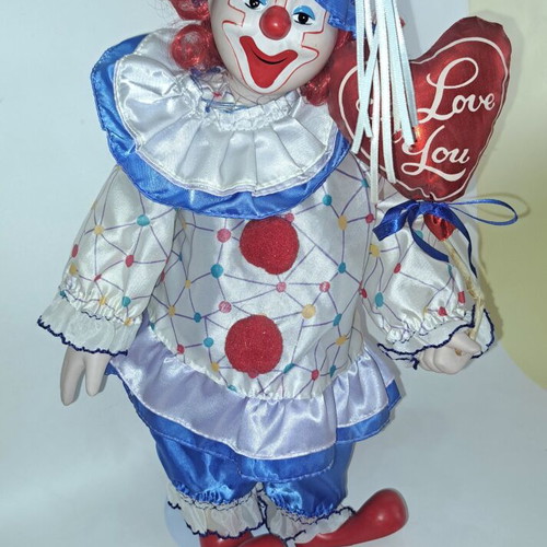 Porcelain clown doll like new, 40 cm with metal base