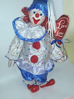 Porcelain clown doll like new, 40 cm with metal base