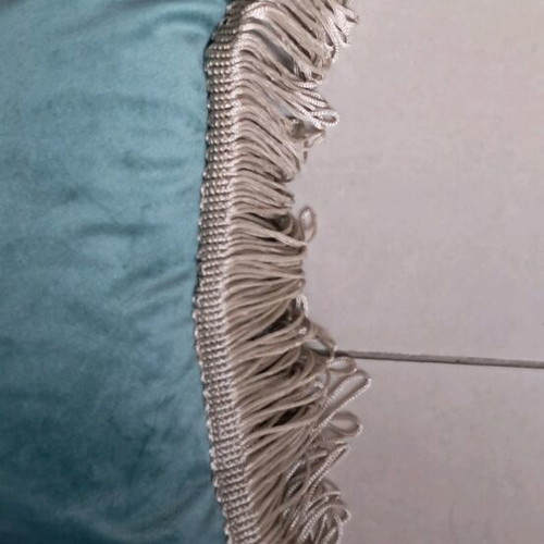 Sofa pillow like new with velvety texture and fringes
