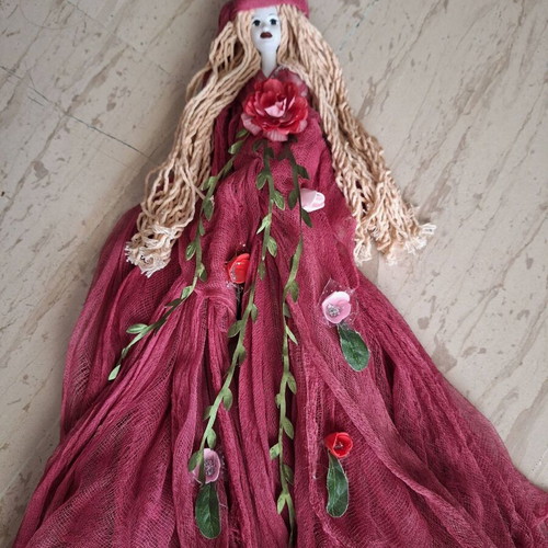 Handmade decorative wall doll with ceramic face and burgundy dress