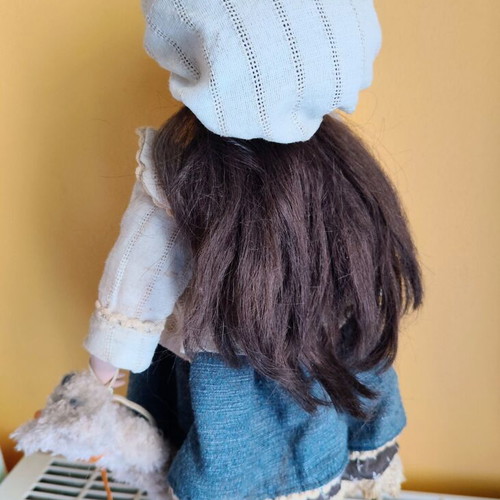 Porcelain doll with stand, 42 cm