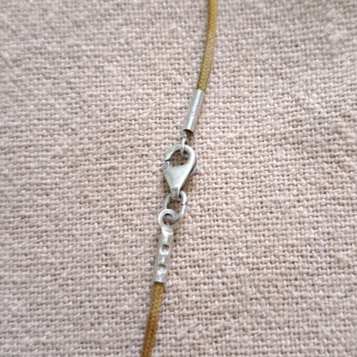 Vally Kontidis Silver Bird Necklace on Ecru Cord like new