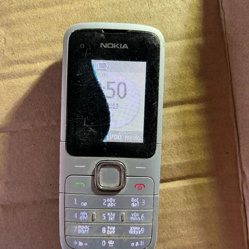 Nokia C1 phone used with broken screen without battery
