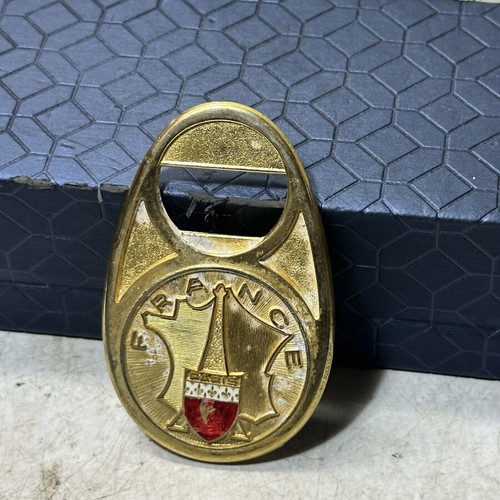 Vintage metal bottle opener Paris with embossed city crest, used
