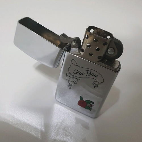 Zippo lighter used small size with engraved design