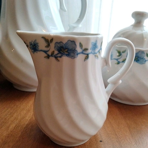 Vintage tea and coffee set in white porcelain like new