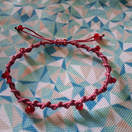 Macrame bracelet with decorative red beads, like new