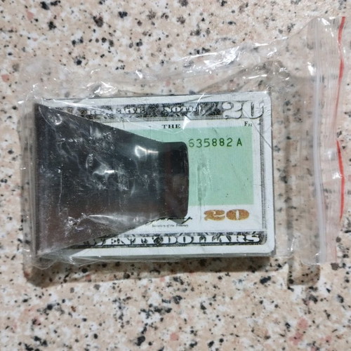 Metal cash and card holder used