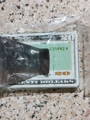 Metal cash and card holder used