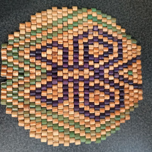 Pot holder used, wooden beads ethnic pattern 17 cm diameter