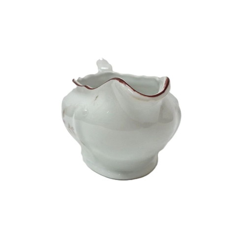 Vintage porcelain sauceboat with floral motif like new