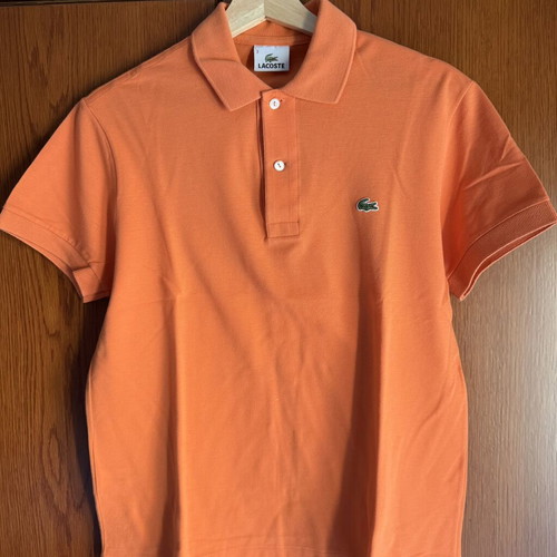 Lacoste polo shirt like new, size 3, peach color