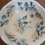 Hand-painted clay bowl like new with floral design