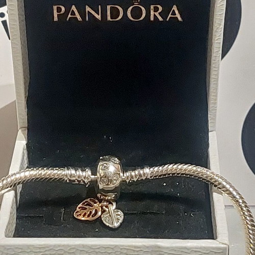 Pandora bracelet size 18 with round clasp and two leaf charms