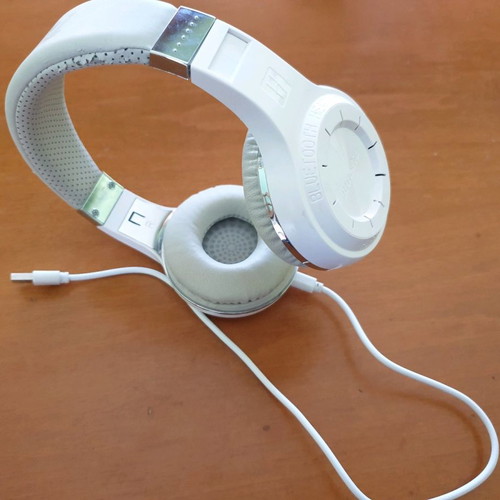 Bluetooth headphones used, white with MP3 and memory card options