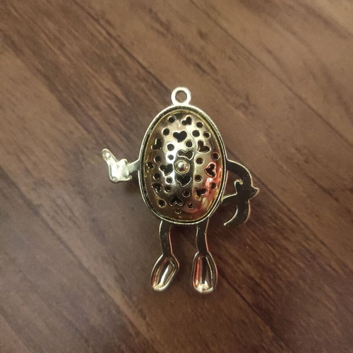 The Smiling Child pendant necklace like new, gold with white enamel