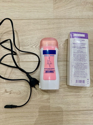Electric hair removal wax warmer like new with 100 strips