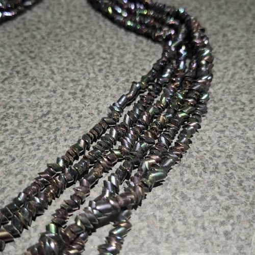 Torsade necklace used with iridescent carnival glass beads, 50cm