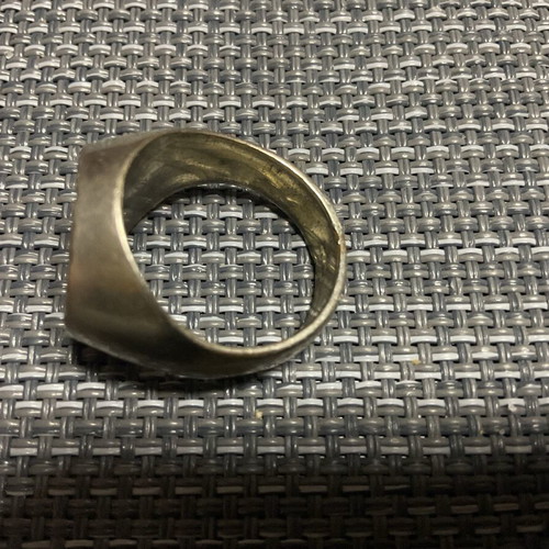 Men's metal ring used with signs of wear