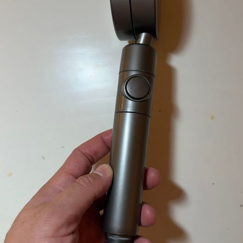 Modern shower head with stop button and flow selector, gunmetal