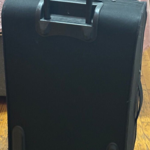 Benetton fabric black suitcase used with two wheels