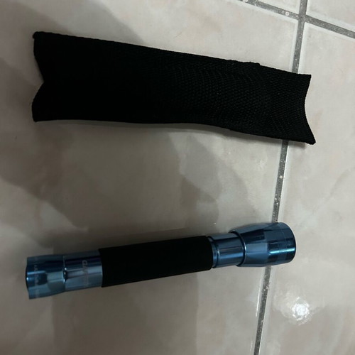 Handheld flashlight like new with belt case