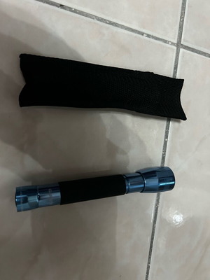 Handheld flashlight like new with belt case
