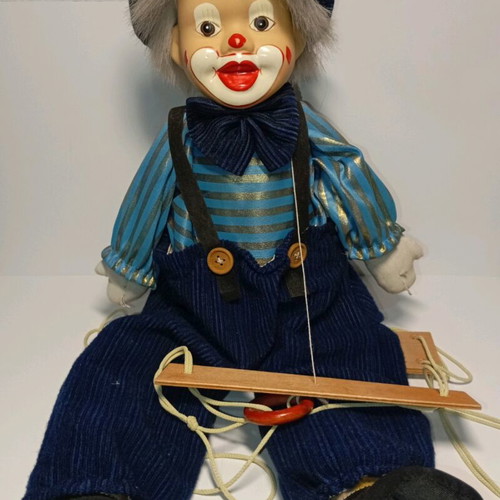 Marionette clown used with wooden control bar