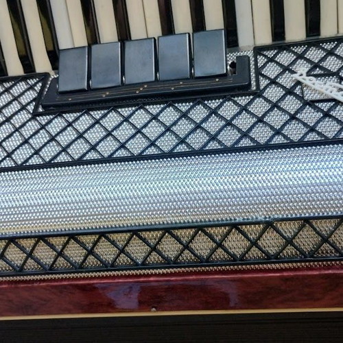 Vostok Accordion like new, red pearl vintage with case and books