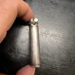 Silver lighter used, unknown if working