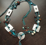 Belt with cords, beads and metal elements like new, adjustable 1.28cm