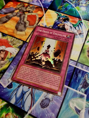The Grave of Enkindling DP2 Super Rare Yu-Gi-Oh! card