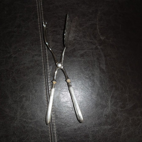 Silver serving spatula used, ornate