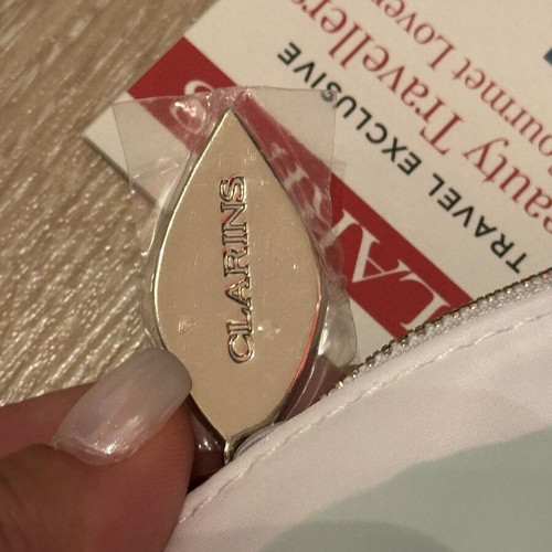 Clarins white bag with zipper new