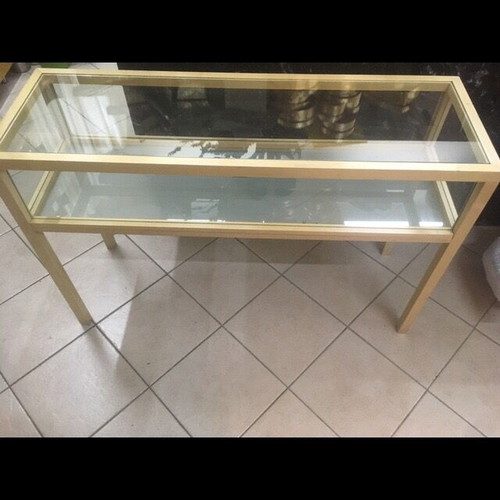 Console used with wooden frame and glass surfaces