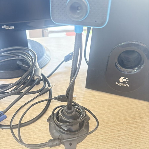 Fujitsu-Siemens computer monitor and Logitech speakers with keyboard and webcam