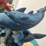 Decorative dolphins refurbished with damage