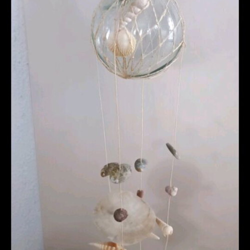 Melodos with seashells decorative used, glass base