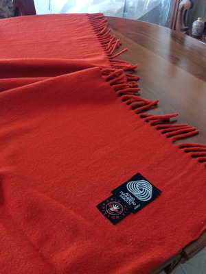 Wool blanket like new, solid brick red color